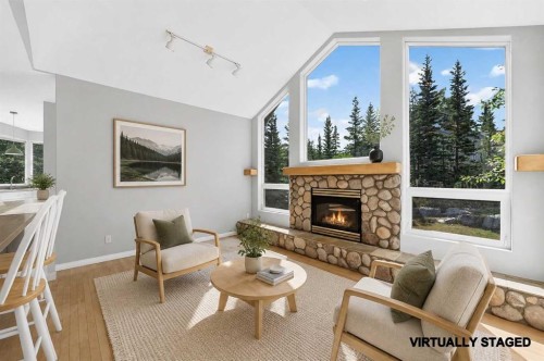 129 Carey, Canmore, AB - Indoor Photo Showing Living Room With Fireplace