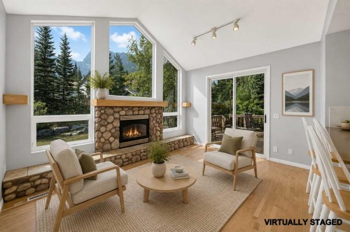 129 Carey, Canmore, AB - Indoor Photo Showing Living Room With Fireplace