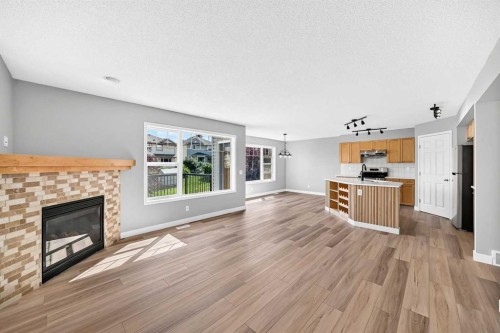 94 Panamount Rise Nw, Calgary, AB - Indoor Photo Showing Living Room With Fireplace
