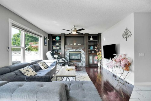 7276 California Boulevard Ne, Calgary, AB - Indoor Photo Showing Living Room With Fireplace