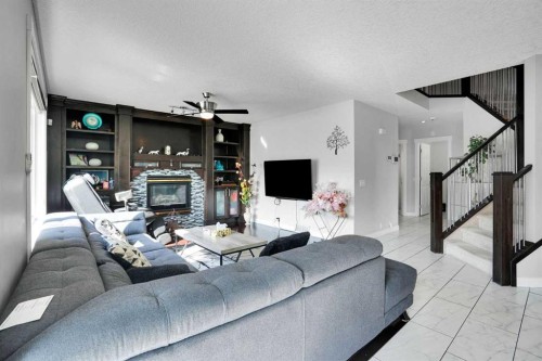 7276 California Boulevard Ne, Calgary, AB - Indoor Photo Showing Living Room With Fireplace