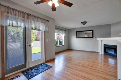 158 Saratoga Close Ne, Calgary, AB - Indoor Photo Showing Living Room With Fireplace