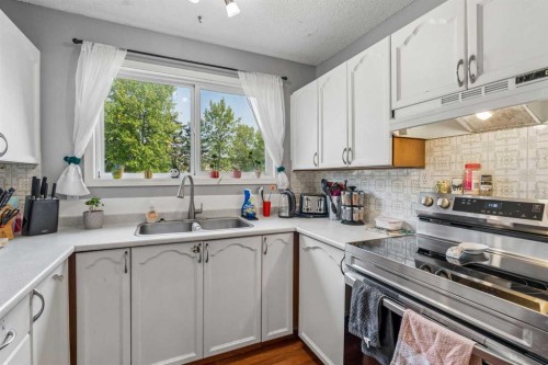 5603 1 Avenue Se, Calgary, AB - Indoor Photo Showing Kitchen With Stainless Steel Kitchen With Double Sink