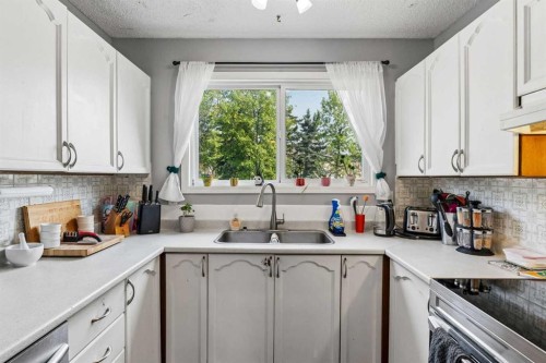 5603 1 Avenue Se, Calgary, AB - Indoor Photo Showing Kitchen With Double Sink