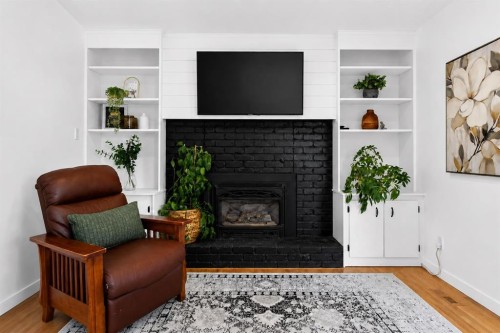 10719 Mapleglen Crescent Se, Calgary, AB - Indoor Photo Showing Living Room With Fireplace