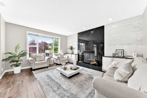 23 Everoak Bay Sw, Calgary, AB - Indoor Photo Showing Living Room With Fireplace