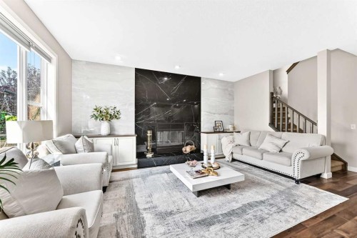 23 Everoak Bay Sw, Calgary, AB - Indoor Photo Showing Living Room With Fireplace