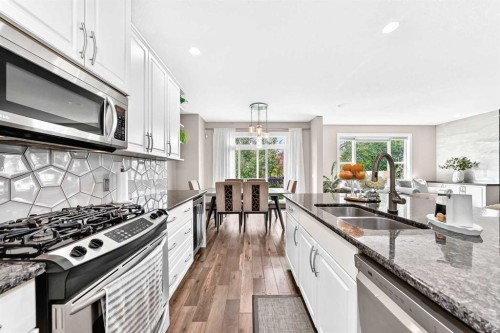 23 Everoak Bay Sw, Calgary, AB - Indoor Photo Showing Kitchen With Stainless Steel Kitchen With Double Sink With Upgraded Kitchen