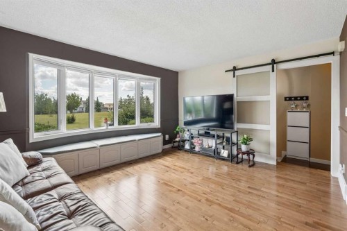 744 Riverbend Drive Se, Calgary, AB - Indoor Photo Showing Living Room