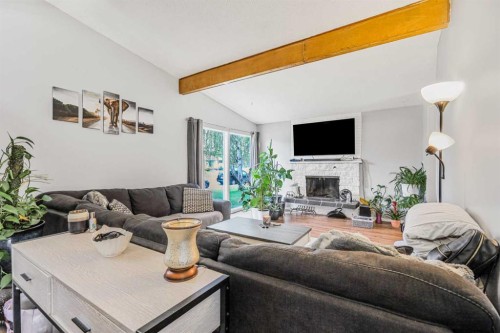 5112 Maryvale Drive Ne, Calgary, AB - Indoor Photo Showing Living Room With Fireplace