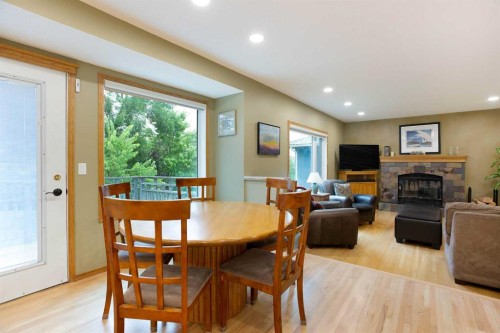 337 Sandringham Court Nw, Calgary, AB - Indoor Photo Showing Dining Room With Fireplace