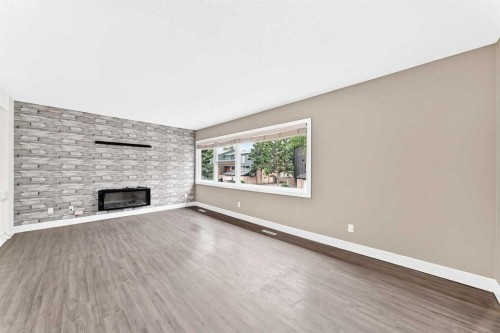 84 Brae Glen Lane Sw, Calgary, AB - Indoor Photo Showing Other Room With Fireplace