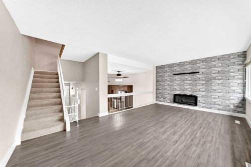 84 Brae Glen Lane Sw, Calgary, AB - Indoor With Fireplace