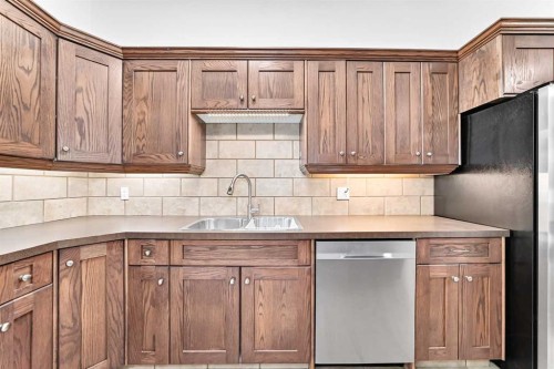 84 Brae Glen Lane Sw, Calgary, AB - Indoor Photo Showing Kitchen With Double Sink