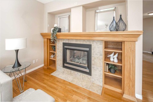 66 Royal Oak Grove Nw, Calgary, AB - Indoor Photo Showing Living Room With Fireplace