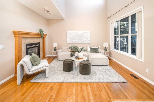 66 Royal Oak Grove Nw, Calgary, AB - Indoor Photo Showing Living Room With Fireplace