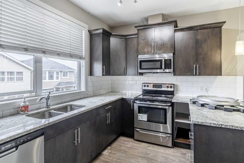634 Redstone View Ne, Calgary, AB - Indoor Photo Showing Kitchen With Stainless Steel Kitchen With Double Sink With Upgraded Kitchen
