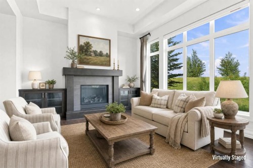 117 Spring Water Close, Heritage Pointe, AB - Indoor Photo Showing Living Room With Fireplace