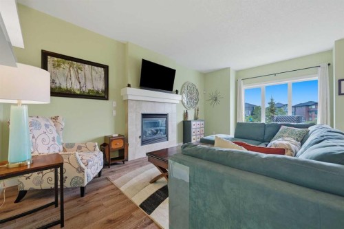 224 Kingston Way Se, Airdrie, AB - Indoor Photo Showing Living Room With Fireplace