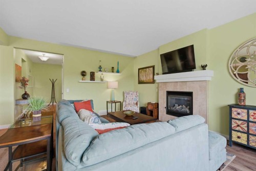 224 Kingston Way Se, Airdrie, AB - Indoor Photo Showing Living Room With Fireplace