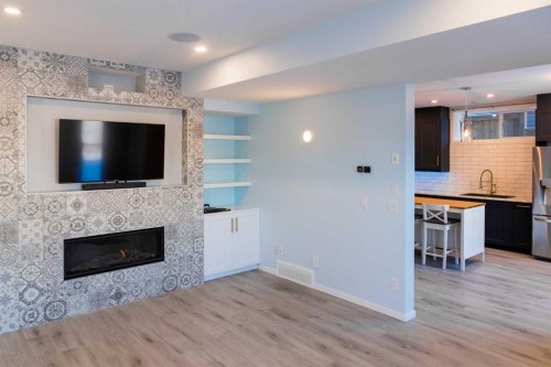 224 Kingston Way Se, Airdrie, AB - Indoor Photo Showing Living Room With Fireplace