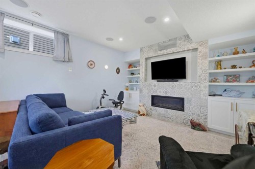 224 Kingston Way Se, Airdrie, AB - Indoor Photo Showing Living Room With Fireplace