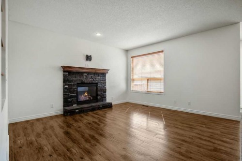 134 Prestwick Terrace Se, Calgary, AB - Indoor Photo Showing Living Room With Fireplace