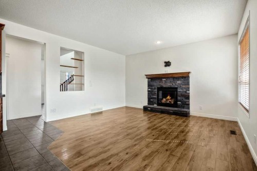 134 Prestwick Terrace Se, Calgary, AB - Indoor Photo Showing Living Room With Fireplace