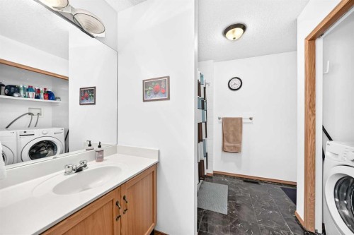 98 Country Hills Heights Nw, Calgary, AB - Indoor Photo Showing Laundry Room