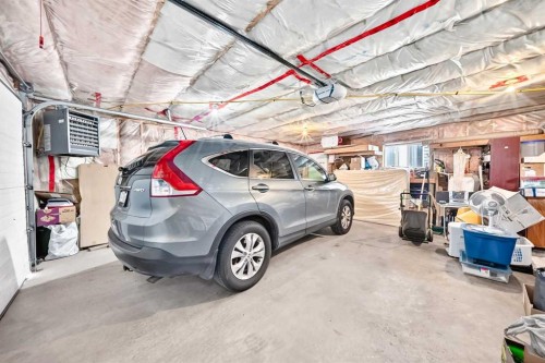98 Country Hills Heights Nw, Calgary, AB - Indoor Photo Showing Garage