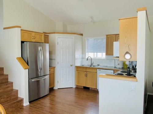 98 Country Hills Heights Nw, Calgary, AB - Indoor Photo Showing Kitchen With Double Sink