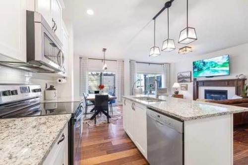 204 Paint Horse Drive, Cochrane, AB - Indoor Photo Showing Kitchen With Upgraded Kitchen