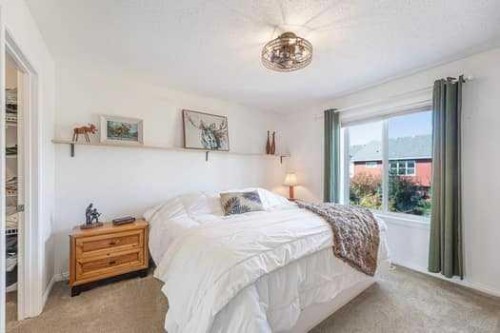 204 Paint Horse Drive, Cochrane, AB - Indoor Photo Showing Bedroom