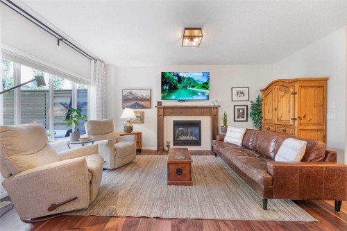 204 Paint Horse Drive, Cochrane, AB - Indoor Photo Showing Living Room With Fireplace