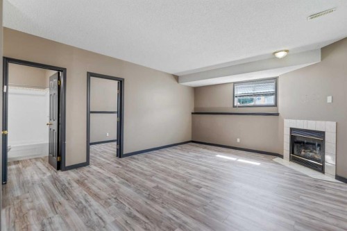 139 Los Alamos Place Ne, Calgary, AB - Indoor With Fireplace