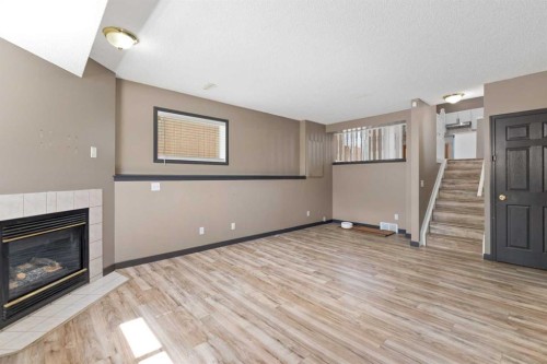 139 Los Alamos Place Ne, Calgary, AB - Indoor With Fireplace