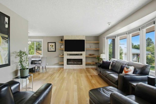 736 Canfield Place Sw, Calgary, AB - Indoor Photo Showing Living Room With Fireplace