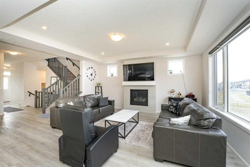 717 Windrow Manor Sw, Airdrie, AB - Indoor Photo Showing Living Room With Fireplace