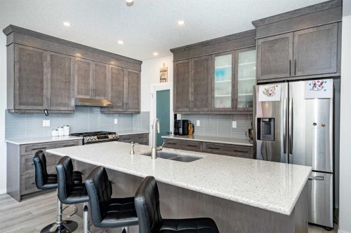 717 Windrow Manor Sw, Airdrie, AB - Indoor Photo Showing Kitchen With Stainless Steel Kitchen With Double Sink With Upgraded Kitchen