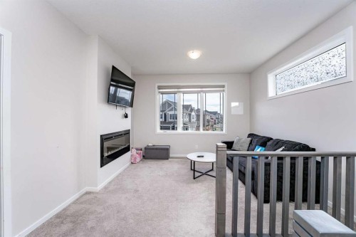 717 Windrow Manor Sw, Airdrie, AB - Indoor With Fireplace