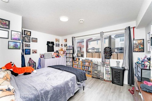 717 Windrow Manor Sw, Airdrie, AB - Indoor Photo Showing Bedroom
