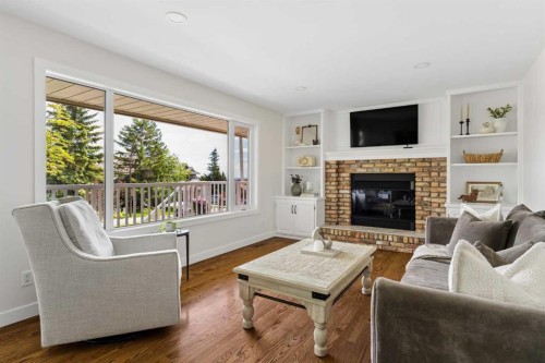 5 Sienna Hills Court Sw, Calgary, AB - Indoor Photo Showing Living Room With Fireplace
