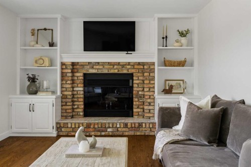 5 Sienna Hills Court Sw, Calgary, AB - Indoor Photo Showing Living Room With Fireplace