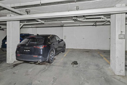 208-2000 Applevillage Court Se, Calgary, AB - Indoor Photo Showing Garage