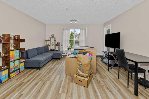 208-2000 Applevillage Court Se, Calgary, AB - Indoor Photo Showing Living Room