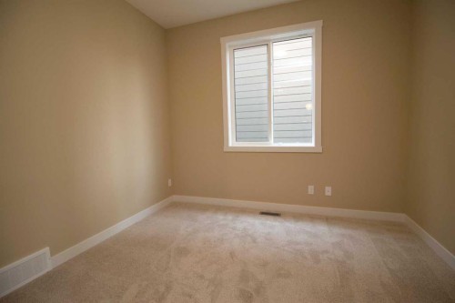 127 Sundown Crescent, Cochrane, AB - Indoor Photo Showing Other Room