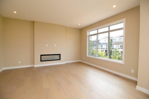 127 Sundown Crescent, Cochrane, AB - Indoor With Fireplace