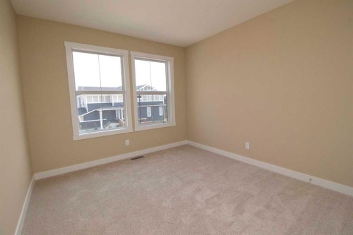 127 Sundown Crescent, Cochrane, AB - Indoor Photo Showing Other Room