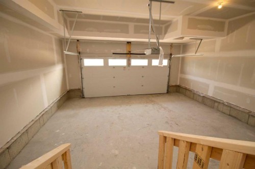 127 Sundown Crescent, Cochrane, AB - Indoor Photo Showing Garage
