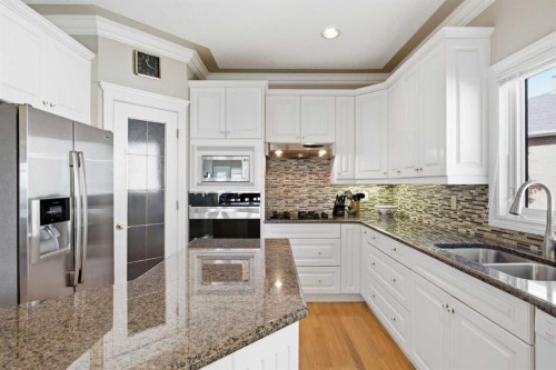 60 Prominence Point Sw, Calgary, AB - Indoor Photo Showing Kitchen With Double Sink With Upgraded Kitchen